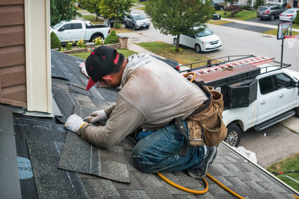 Professional Roofing technician working in Garden City South, NY